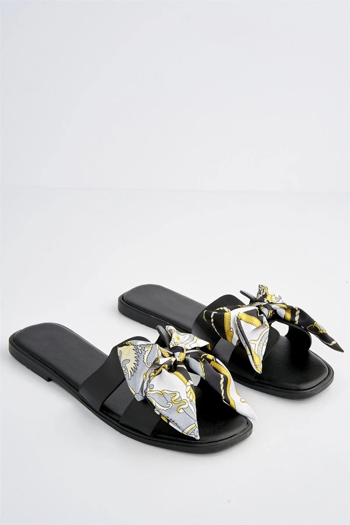 Izzy Printed Bow Flat Sandal in Black